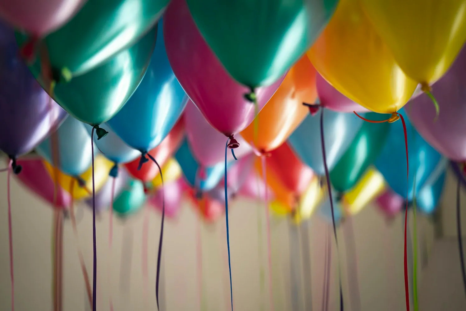 A bunch of colourful party balloons